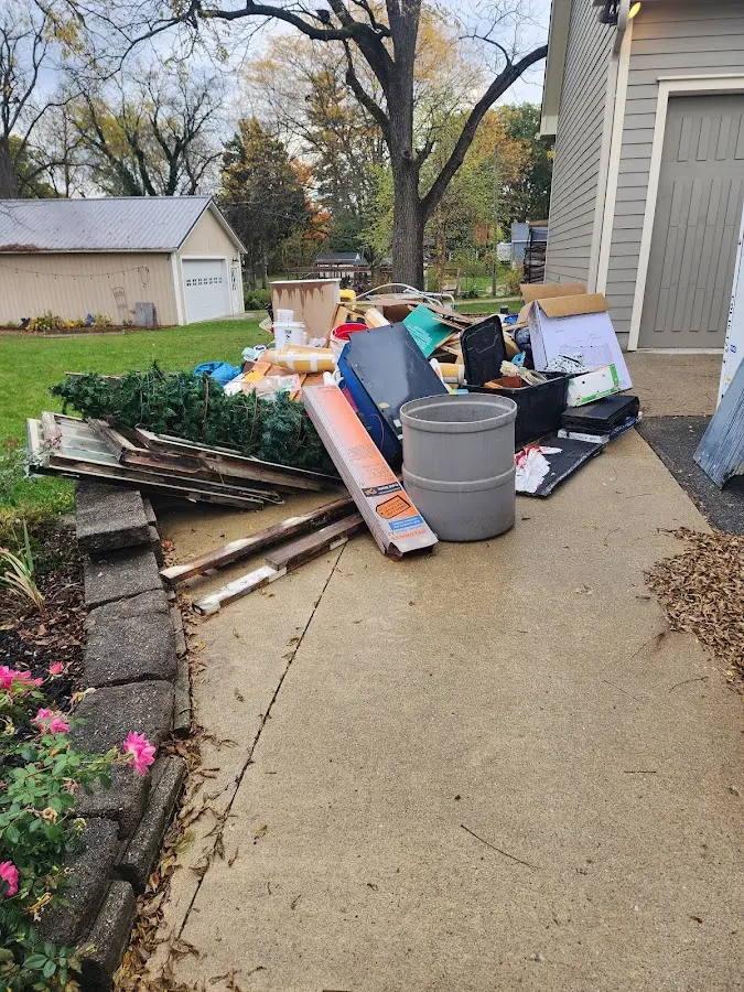 Dumpster being loaded with debris for Roofing Dumpster Rental in Vidor